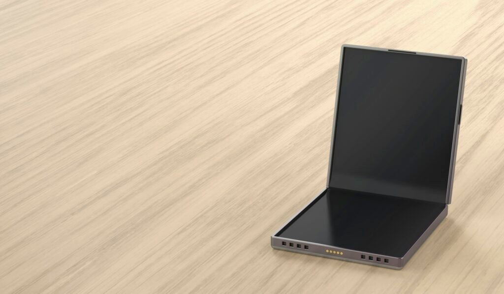 Foldable smartphone on wooden table